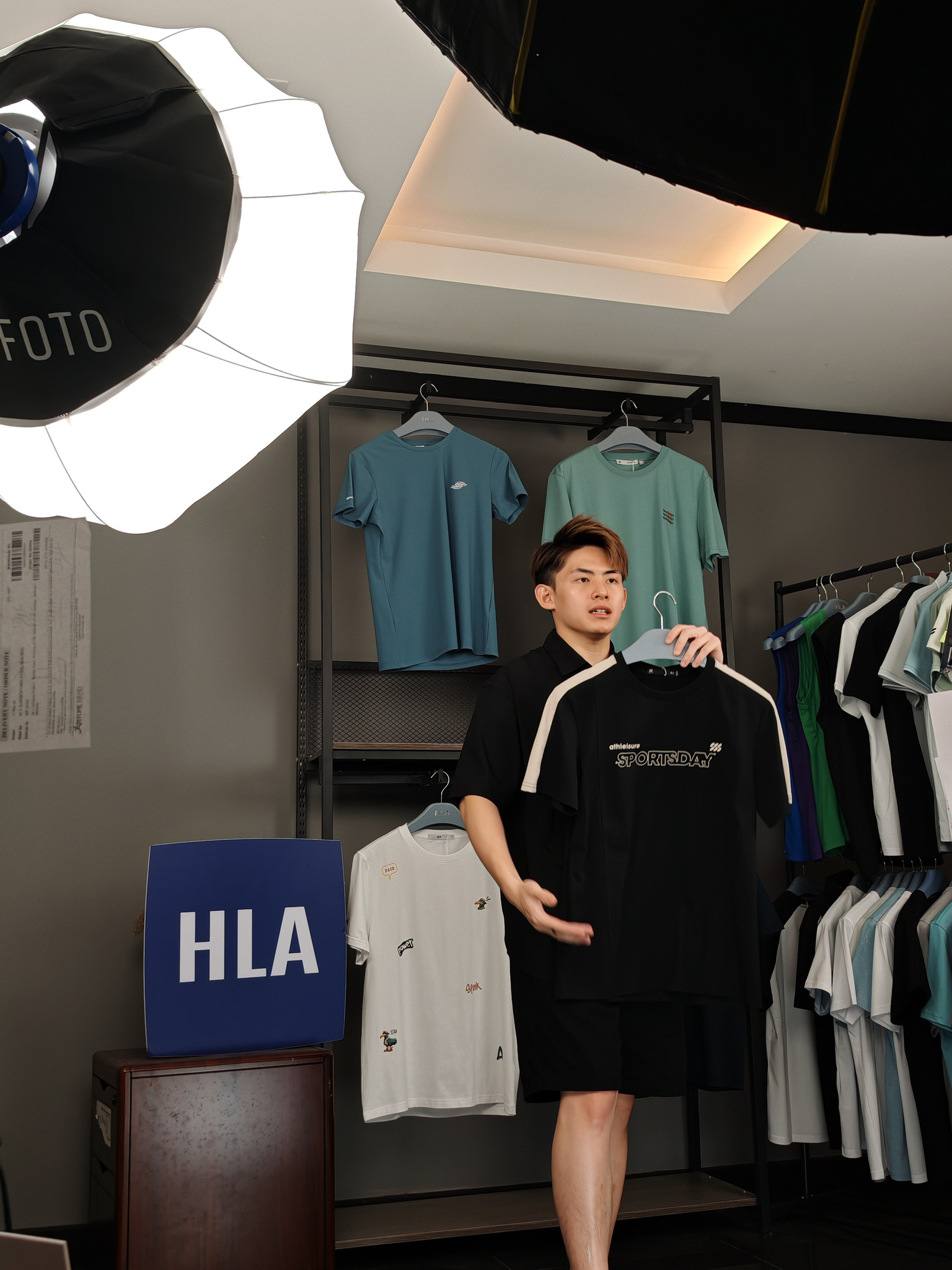 Jlive host presenting apparel in an HLA studio